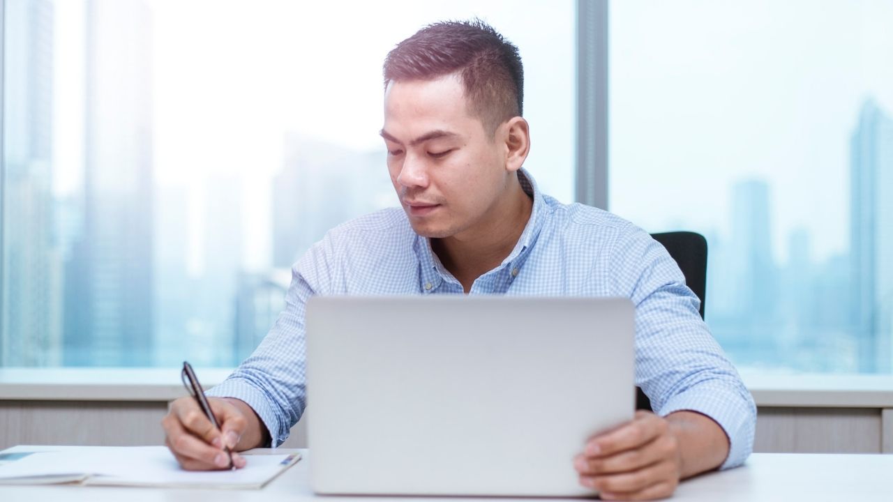Man writing on paper